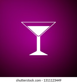 Martini glass icon isolated on purple background. Cocktail icon. Wine glass icon. Flat design. Vector Illustration