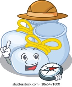 mascot design concept of baby boy boots explorer using a compass in the forest