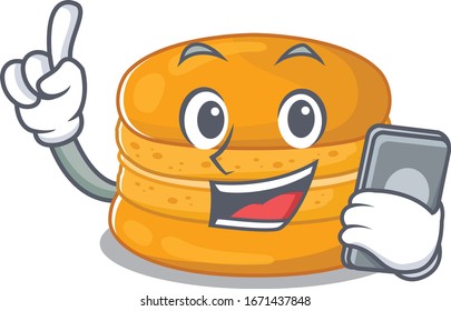 Mascot design of orange macaron speaking on phone