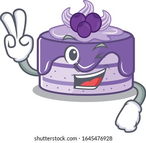 mascot of funny blueberry cake cartoon Character with two fingers