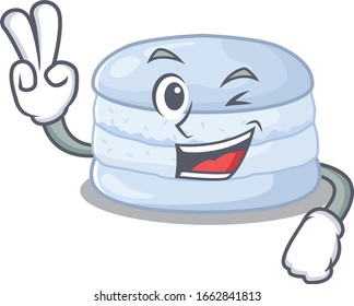 mascot of funny blueberry macaron cartoon Character with two fingers