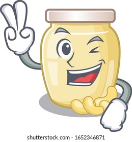 mascot of funny cashew butter cartoon Character with two fingers
