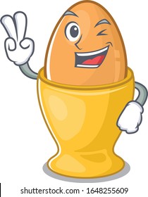 mascot of funny egg cup cartoon Character with two fingers