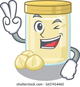 mascot of funny macadamia nut butter cartoon Character with two fingers
