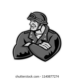 Mascot icon illustration of bust of a male biker or motorcycle club rider wearing a vintage helmet with arms crossed looking to side on isolated background in retro style.