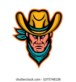 Mascot icon illustration of head of an American cowboy wearing kerchief and hat viewed from front on isolated background in retro style.