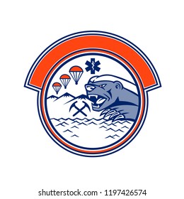 Mascot icon illustration of head of an angry honey badger with crossed pick axes, parachute and star of life EMT symbol representing land, sea and air rescue set in circle on isolated background.