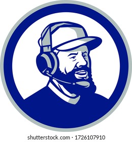 Mascot icon illustration of head of a coach with beard, baseball cap and wearing headphones or headset looking forward to side set inside circle on isolated white background in retro style.