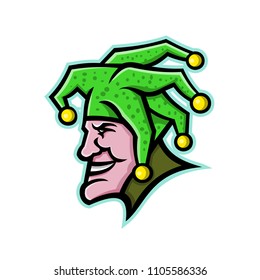 Mascot icon illustration of head of a harlequin, jester, minstrel, joker, medieval singer or musician, entertainer viewed from side on isolated background in retro style.