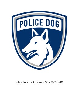 Mascot icon illustration of head of a police dog, German Shepherd, Alsatian wolf dog or sometimes abbreviated as GSD looking to side set inside shield or crest isolated background in retro style.