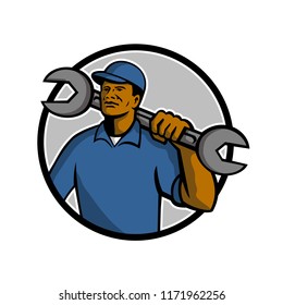 Mascot illustration of an African American mechanic holding a spanner wrench on shoulder set inside circle on isolated white background done in retro style.