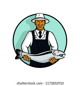 Mascot illustration of a black African American fishmonger holding a trout or salmon fish set inside circle on isolated white background done in retro style.