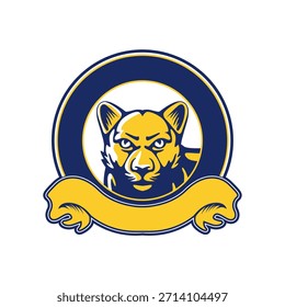 Logotipo de la mascota con una leona en colores azul y amarillo, dispuestos en un emblema circular con una cinta en la parte inferior. Representa fortaleza, confianza, liderazgo y orgullo. Adecuado para los deportes