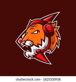 Mascot logo Tiger head esport with emblem and headphone in brown background