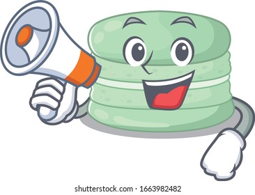 A mascot of pistachio macaron speaking on a megaphone