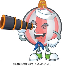 Mascot a sailor holding binocular in cartoon christmas ball