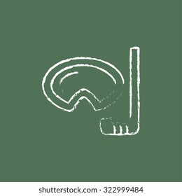 Mask and snorkel hand drawn in chalk on a blackboard vector white icon isolated on a green background.