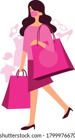 Masked woman walking while holding shopping bags