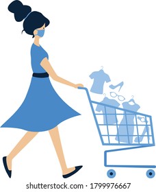 Masked woman walking while pulling a shopping trolley