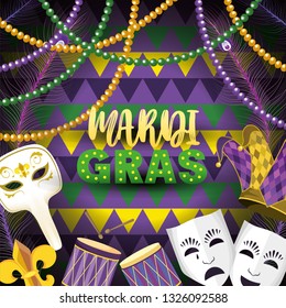 masks with mardi grass emblem and drum to event