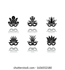 Masquerade masks drop shadow black glyph icons set. Traditional headwear with plumage. Ethnic festival. Brazilian national holiday. Isolated vector illustrations on white space