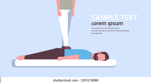 masseuse standing on patient's back doing healing treatment guy relaxing lying on table man having massage medical clinic manual therapy concept horizontal copy space