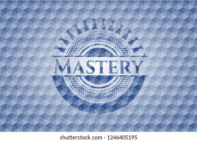 Mastery blue badge with geometric pattern.