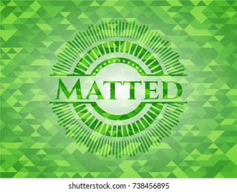 Matted green emblem with mosaic background