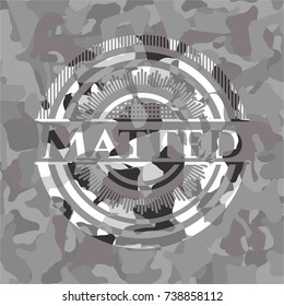 Matted grey camouflaged emblem