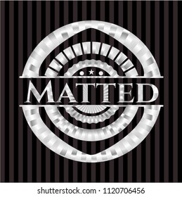 Matted silver emblem