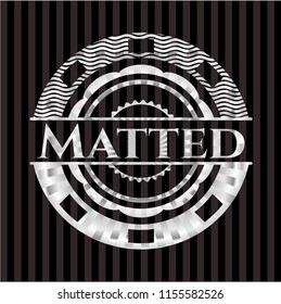 Matted silvery badge