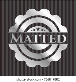 Matted silvery emblem or badge