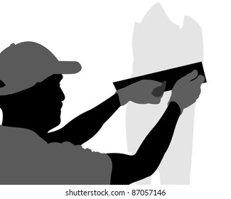 Mature contractor plasterer working indoors