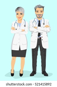 mature doctors standing with arms folded