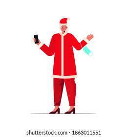 mature santa woman with mask using smartphone new year christmas holidays celebration coronavirus quarantine concept full length vector illustration