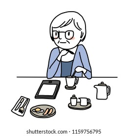 Mature woman stirring coffee and reading e-book or reading online content on tablet computer at breakfast time. Elderly woman reading e-book, stirring coffee in a cup while sitting at table in cafe.