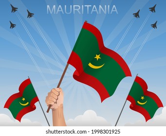 Banderas de Mauritania ondeando bajo el cielo azul