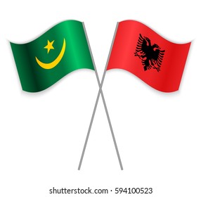 Mauritanian and Albanian crossed flags. Mauritania combined with Albania isolated on white. Language learning, international business or travel concept.
