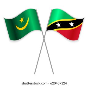 Mauritanian and Kittitian crossed flags. Mauritania combined with Saint Kitts and Nevis isolated on white. Language learning, international business or travel concept.