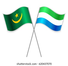 Mauritanian and Sierra Leonean crossed flags. Mauritania combined with Sierra Leone isolated on white. Language learning, international business or travel concept.