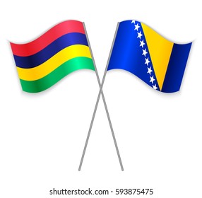 Mauritian and Bosnian crossed flags. Mauritius combined with Bosnia and Herzegovina isolated on white. Language learning, international business or travel concept.
