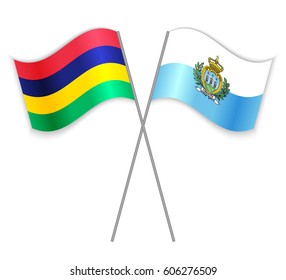 Mauritian and Sammarinese crossed flags. Mauritius combined with San Marino isolated on white. Language learning, international business or travel concept.