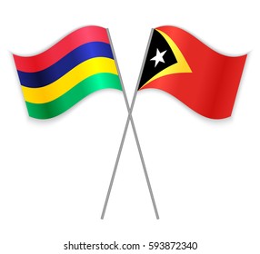Mauritian and Timorese crossed flags. Mauritius combined with East Timor isolated on white. Language learning, international business or travel concept.