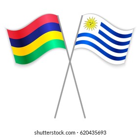 Mauritian and Uruguayan crossed flags. Mauritius combined with Uruguay isolated on white. Language learning, international business or travel concept.