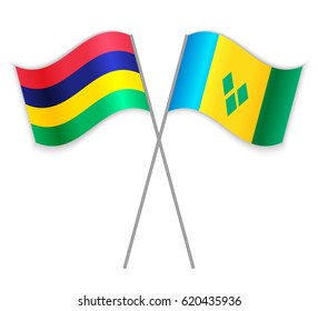 Mauritian and Vincentian crossed flags. Mauritius combined with Saint Vincent and the Grenadines isolated on white. Language learning, international business or travel concept.