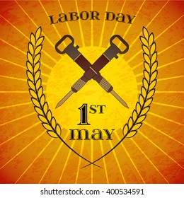 May Day. May 1st. Labor Day background with crossed jackhammers and wheat ears over retro rays background. Poster, greeting card or brochure template, symbol of work and labor, vector icon
