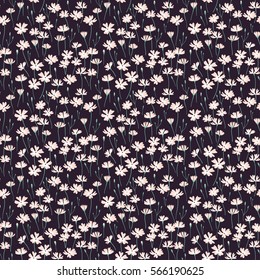 Meadow. Wildflowers pattern. Cute pattern in small flower. Small white flowers. Dark Blue background. The elegant the template for fashion prints