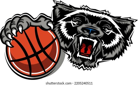 mean wolverine mascot holding basketball for school, college or league