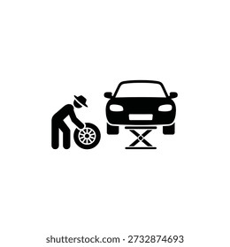 Mechanic changing a car tire with a jack simple black silhouette icon