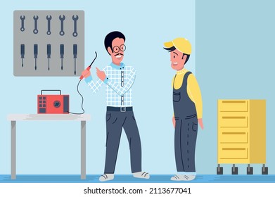 Mechanic chief boss teaching how to use the tools to his employee in mechanical workshop and garage